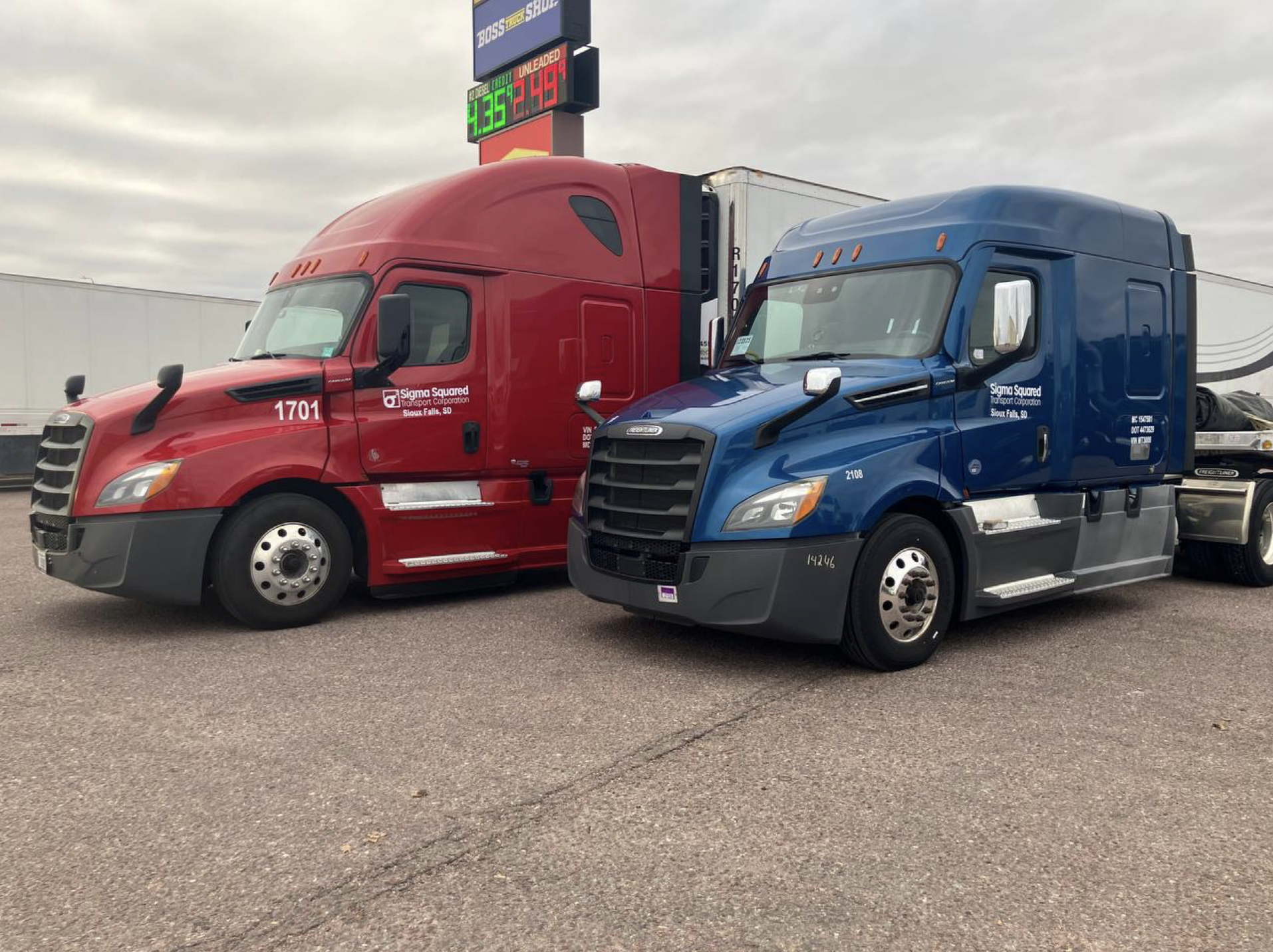 Two Cascadia Freightliner trucks